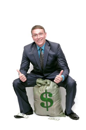 Business man with money bag. The lucky winner. Financial Investments. Profit.の写真素材