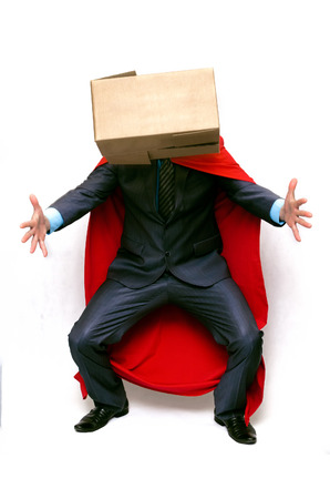Delivery man super hero with cardboard box in hands isolated on white background. Delivery service concept.の写真素材
