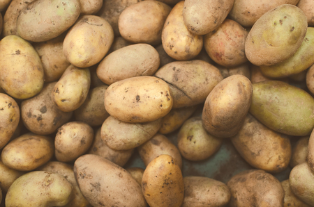 Raw potatoes textre background, top view.の写真素材