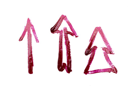 Direction arrows handmade by red nail polish isolated on white background.
