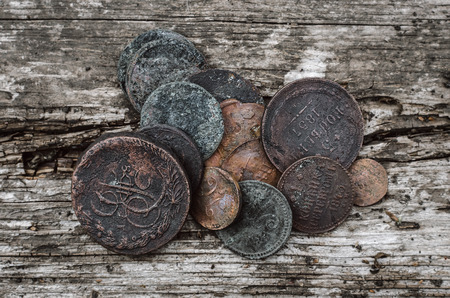 Old coins of Russian empire collection on wooden table background.の写真素材