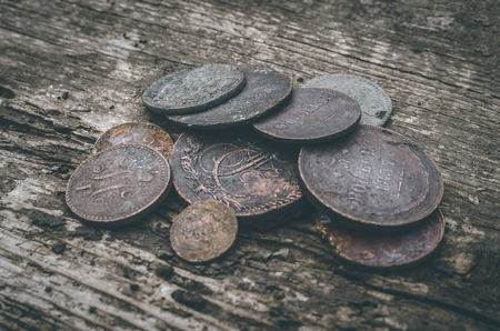 Old coins of Russian empire collection on wooden table background.の写真素材