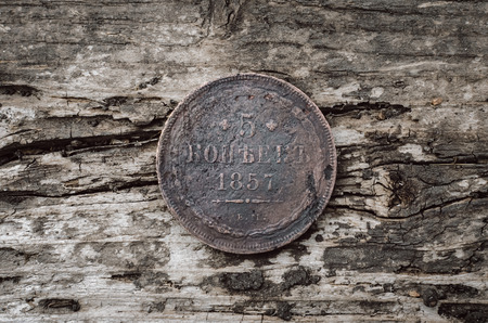Old coin 5 kopeks 1857 year of Russian empire on wooden table background.の写真素材