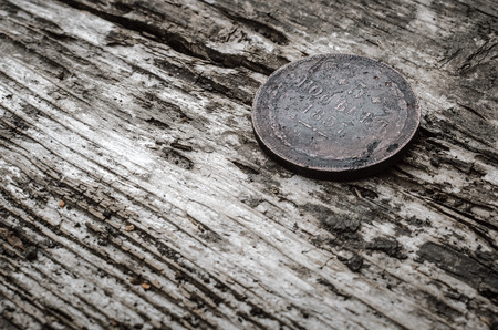 Old coin 5 kopeks 1857 year of Russian empire on wooden table background.の写真素材