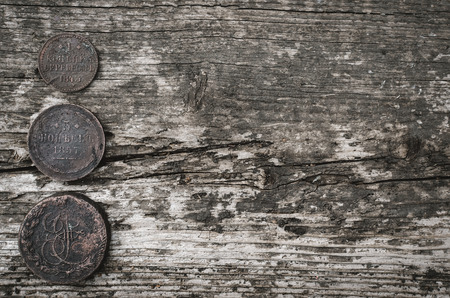 Heap of old coins of Russian empire on wooden table background with copy space.の写真素材