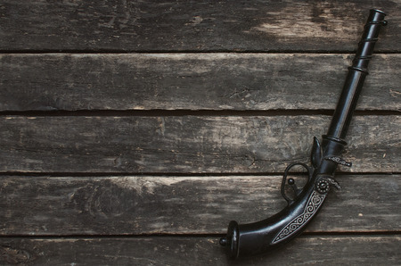 Musket gun on wooden table background with copy space.の写真素材