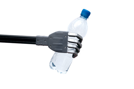 Toy robot hand is holding a bottle of water or petrol isolated on white background.の写真素材