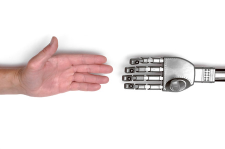 Handshake between hand of human and robot hand isolated on white background. Future concept.