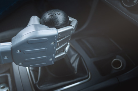 Robot hand on car gearstick. Robot pilot is driving a car. Automatic driver concept.の写真素材