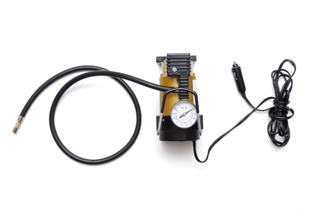 Car pump auto air compressor isolated on the white background.の写真素材