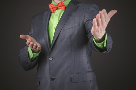 The presenter is giving an introduction on a black background.の写真素材