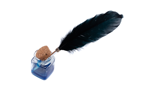 Inkwell with black quill pen isolated on the white background.の写真素材