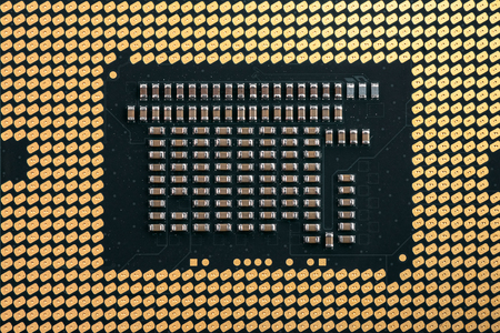 Backside macro photo of a CPU computer chip.