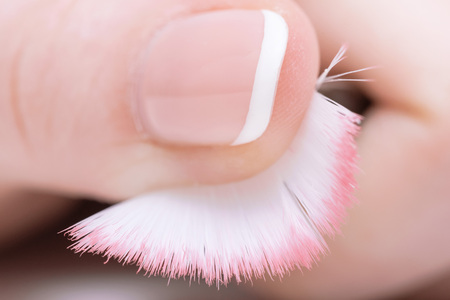 Makeup brash in a female hand close up.の写真素材