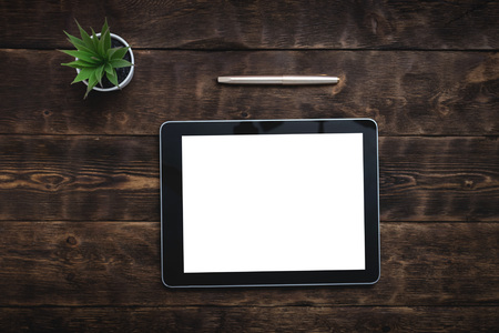 A digital tablet computer frame with blank screen on a office table background. Special offer mock up. Video conference background.の写真素材