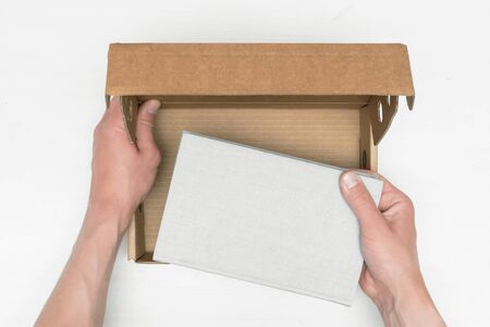 Man got a book in the postal parcel concept.