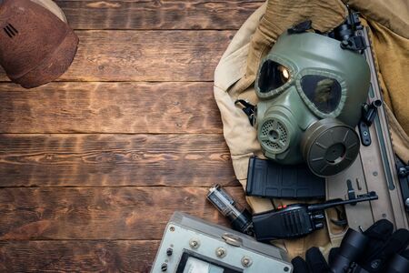 Post apocalypse soldier equipment on the table background.の写真素材