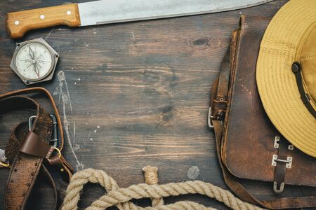 Old travel equipment on the wooden table flat lay background.の写真素材