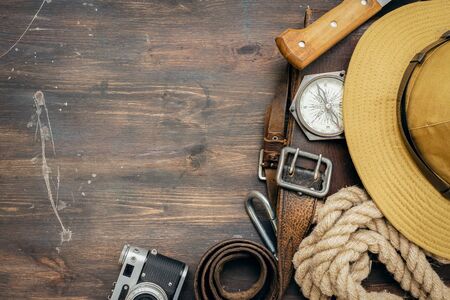 Old travel equipment on the wooden table flat lay background.の写真素材