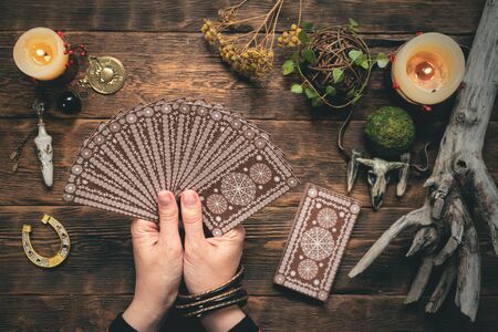 Fortune teller woman reading a future by tarot cards concept.の写真素材