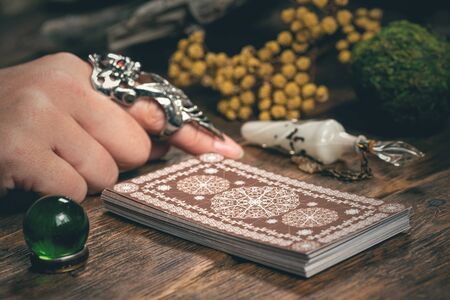 Fortune teller woman reading a future by tarot cards concept.の写真素材