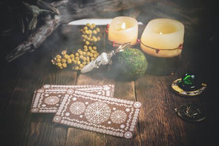 Tarot cards deck on the fortune teller table close up.の写真素材