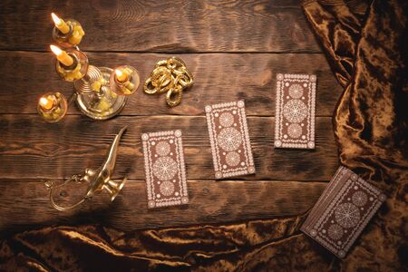 Tarot cards on fortune teller old desk background. Future reading.の写真素材