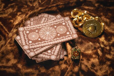 Tarot cards on fortune teller old desk background. Future reading.の写真素材