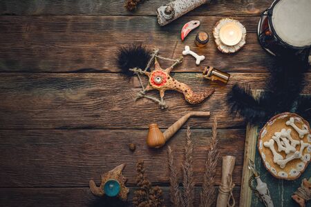 Witchcraft table. Witch doctor. Shamanic accessories. Old magic book.の写真素材