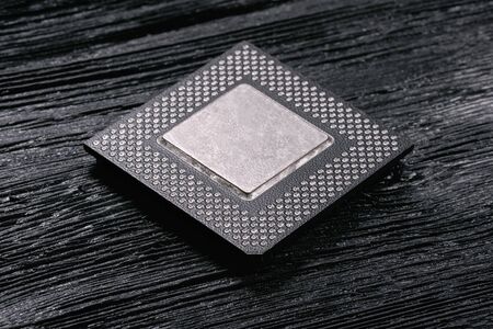 Computer cpu chip on black wooden background.の写真素材