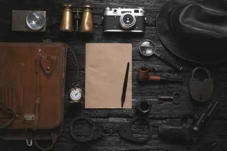 Detective agent table flat lay background. Top secret document mock up. Investigation tips template.の写真素材