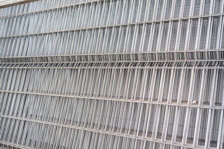 Stainless steel lattice fencing abstract background.