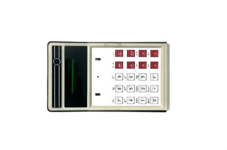 Vintage calculator of the 70s isolated on white background.