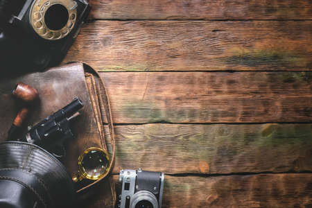 Detective agent desk table with retro accessories flat lay background with copy space.の写真素材