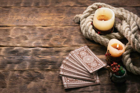 Tarot cards on the wooden table background.の写真素材