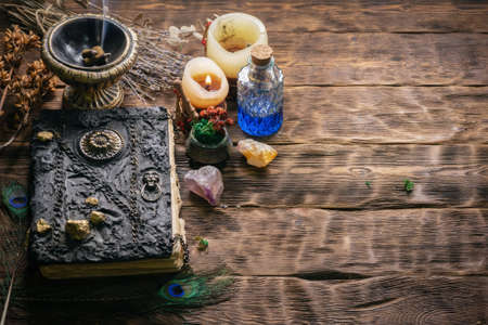 Book of magic on the table. Witchcraft concept background.の写真素材