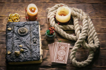 Tarot cards on the wooden table background.の写真素材