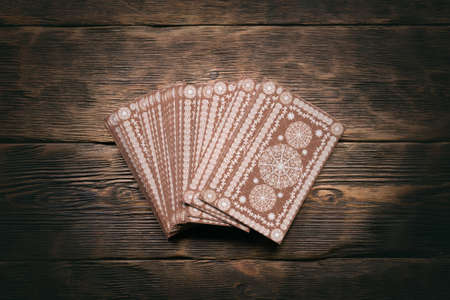 Tarot cards on the wooden table background.の写真素材