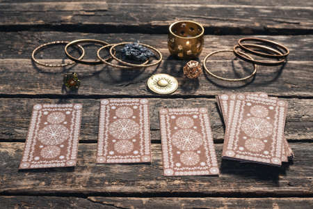 Tarot cards deck on the old wooden table background.の写真素材