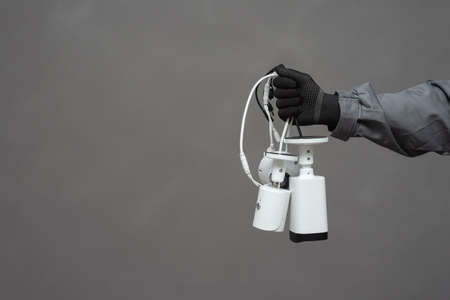 CCTV Installation wizard concept. Service for installing CCTV cameras. Security cameras in the...