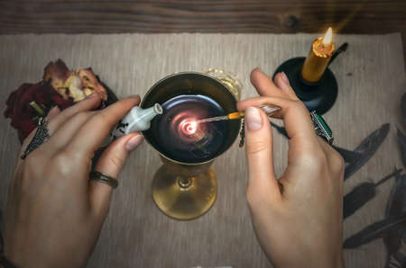 Magic potion. Tarot cards on fortune teller desk table. Future reading.の写真素材