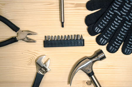 Home construction tools. Different instruments on wooden table.