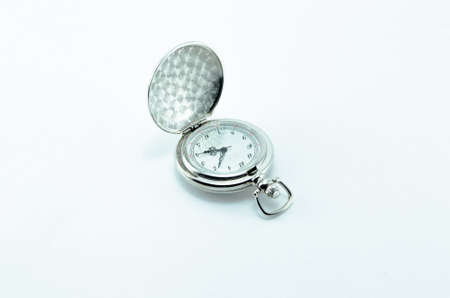 Old vintage open silver pocket watch isolated on white background.