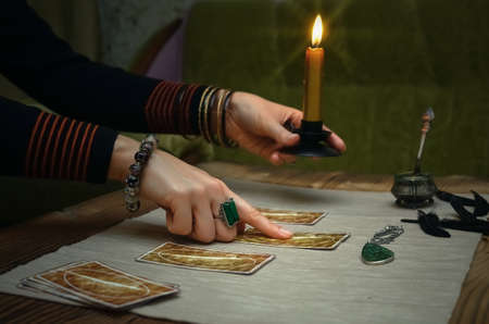 Tarot cards on fortune teller desk table. Future reading.の写真素材