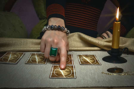 Tarot cards on fortune teller desk table. Future reading.の写真素材