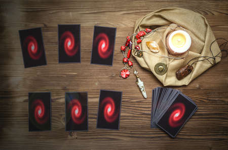 Tarot cards on fortune teller desk table background. Futune reading concept.