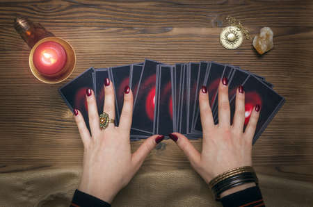 Tarot cards on fortune teller desk table. Future reading concept. Divination.の写真素材