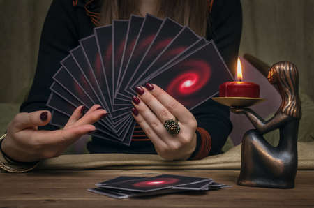 Tarot cards on fortune teller desk table. Future reading concept. Divination.の写真素材
