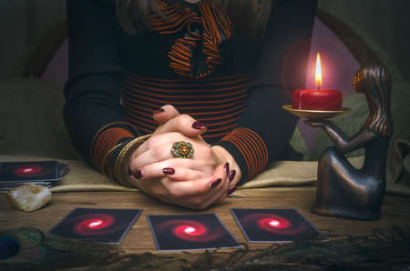 Tarot cards on wooden table. Fortune teller.