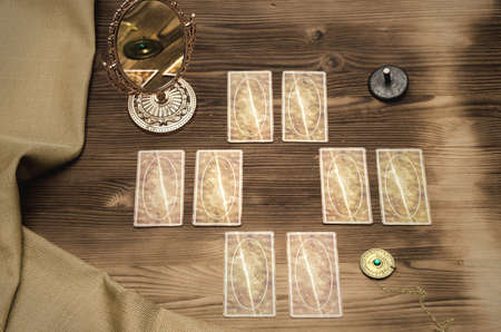 Tarot cards on wooden table. Divination. Fortune teller.の写真素材